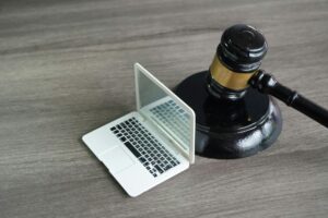 Closeup image of judge gavel and laptop with copy space.