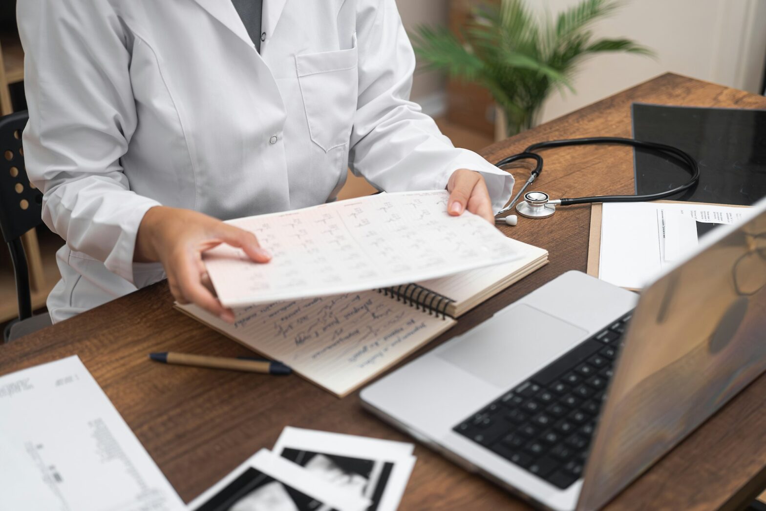 Heart Health close-up, cardiologist inspects patient ECG and ultrasound data, with a computer.