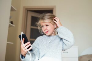 Kid using mobile social media