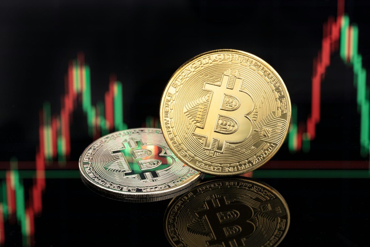 Bitcoin coins on stock chart background